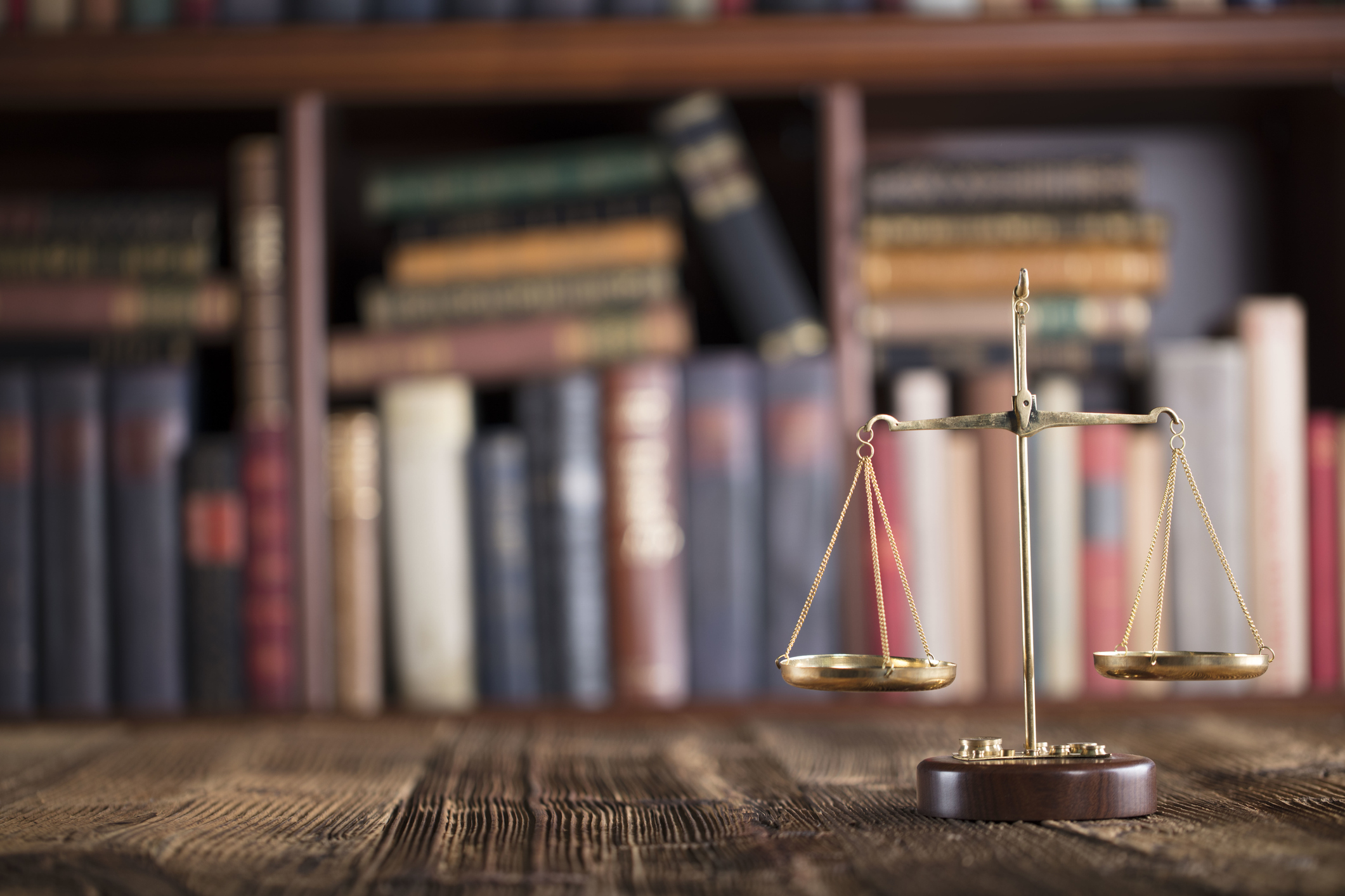 Lawyer office with accounting books in background and scales in foreground