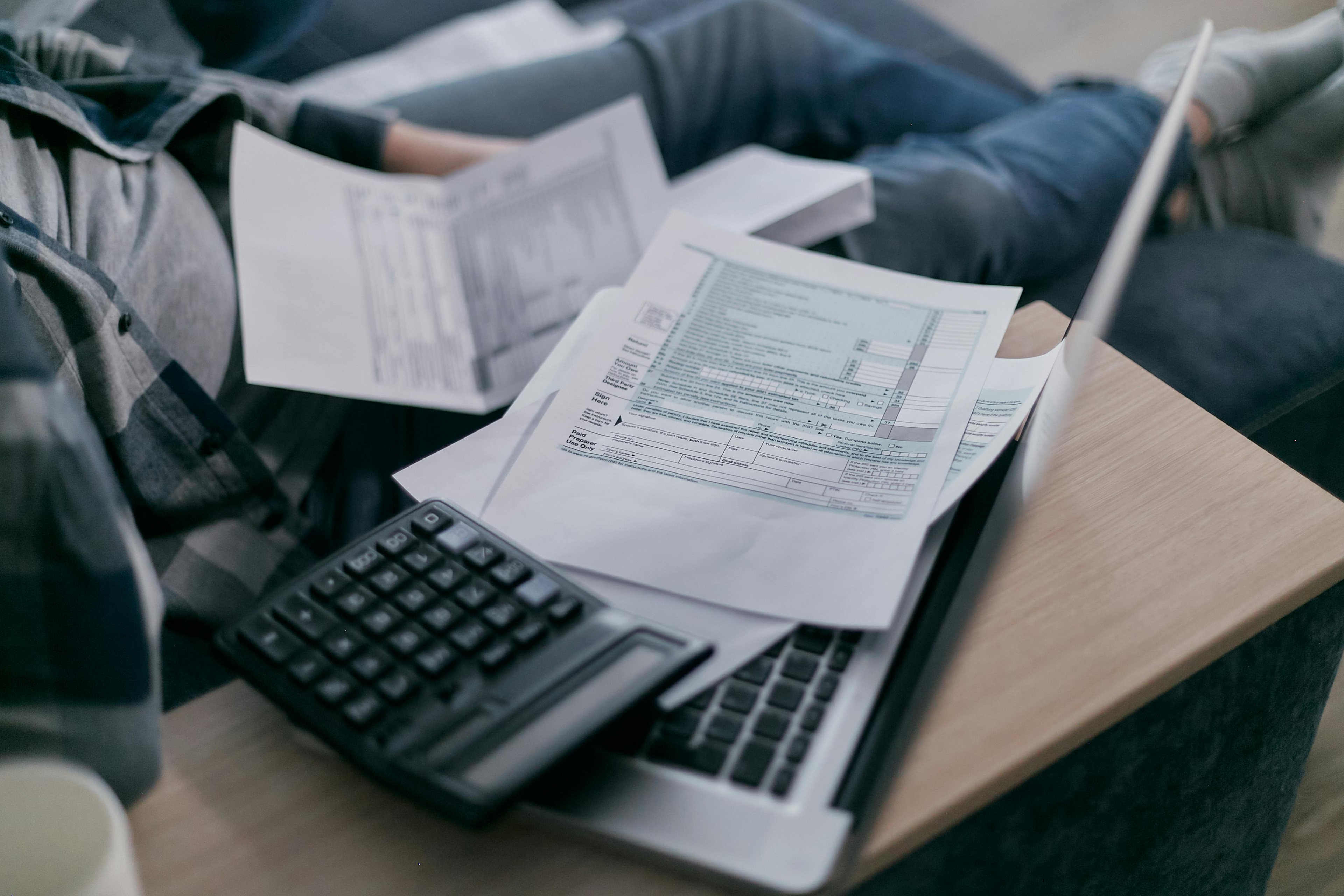 man looking at small business debt management scaled