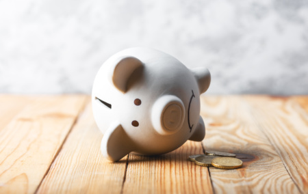 A Sad Piggy Bank Behind Stack Of Euro Coins 2025 02 22 14 45 29 Utc